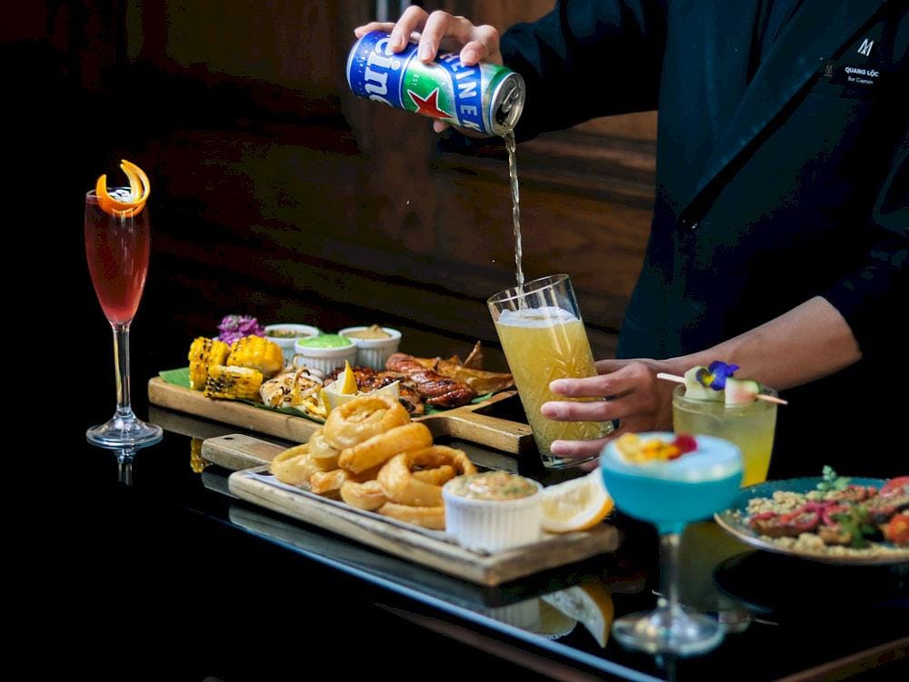 An elegant drink table featuring handcrafted cocktails and upscale finger food